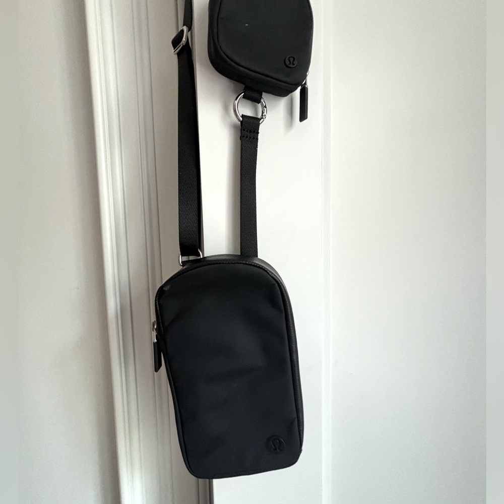 Black nylon Lululemon crossbody phone pouch with AirPods attachment